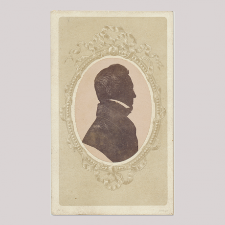 
        Front of silhouette, with man looking right, in painted frame.